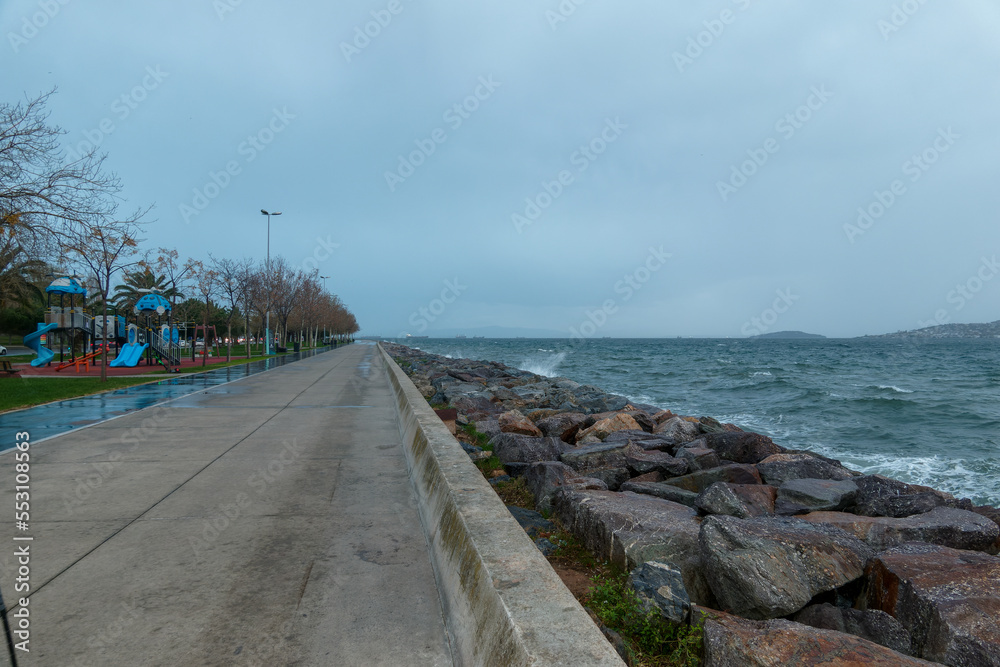 Evening coastal park road in stormy weather, view of sea and islands. Istanbul. Turkey.