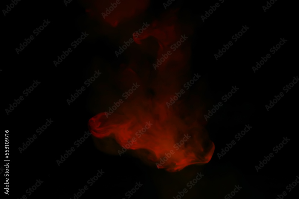 Fototapeta premium Red smoke over black studio background. Red steam on a black background. Copy space.