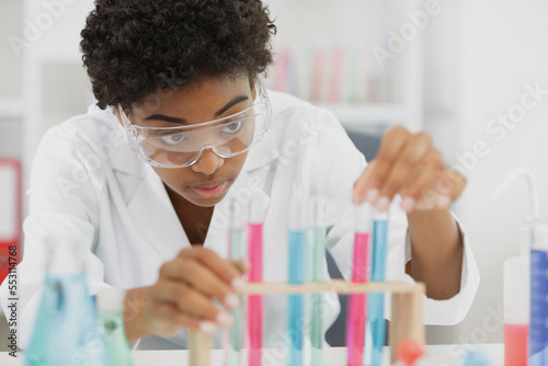 woman lab assistant with a test tube