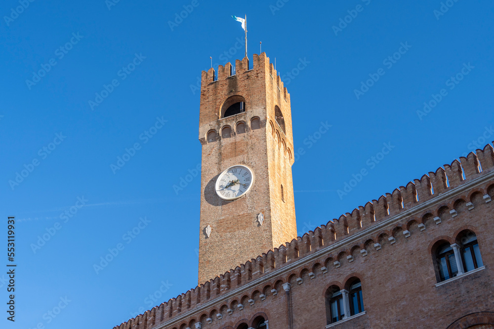 Watch tower in the city center of Treviso, Italy. Beautiful Piazza dei Signori is the Palazzo dei Trecento.