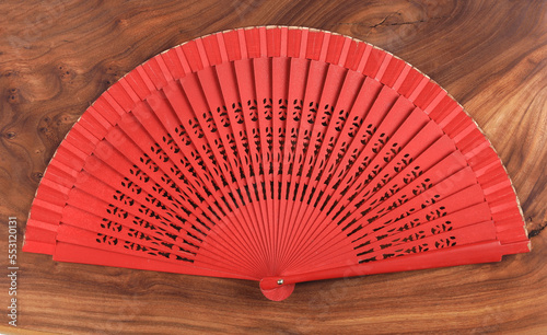 paper chinese fan on wooden background