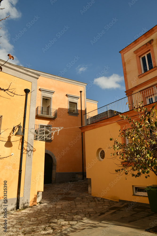 Obraz premium A narrow street in Pozzuoli, a town facing the sea near Naples in Italy.