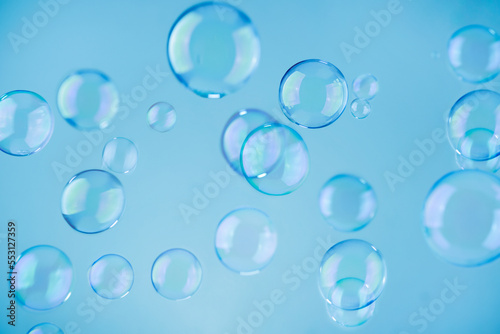 Abstract blue soap bubbles background. Blue soap bubbles wallpaper.