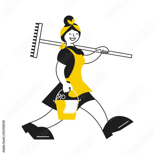 Professional female cleaner is walking and holding bucket and mop