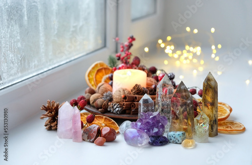 Canvas Print Gemstones crystals, candle, natural festive winter decor on windowsill