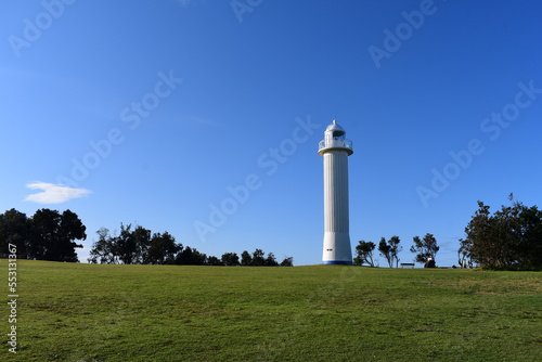 Yamba Lighthouse, NSW, Australia: a white lighthouse that has been providing a permanent light for local shipping since 1880.