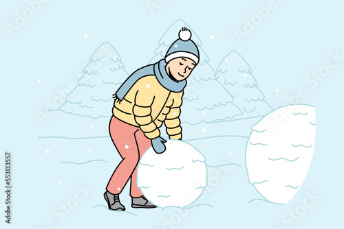 Child rolls big snowball to make snowman outdoors. Boy creates snow sculpture in street. Kid playing winter games outside during snowfall. Vector outline colorful isolated illustration.