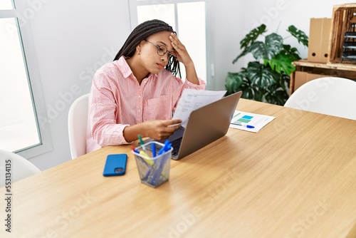 Young african american woman stressed working at office