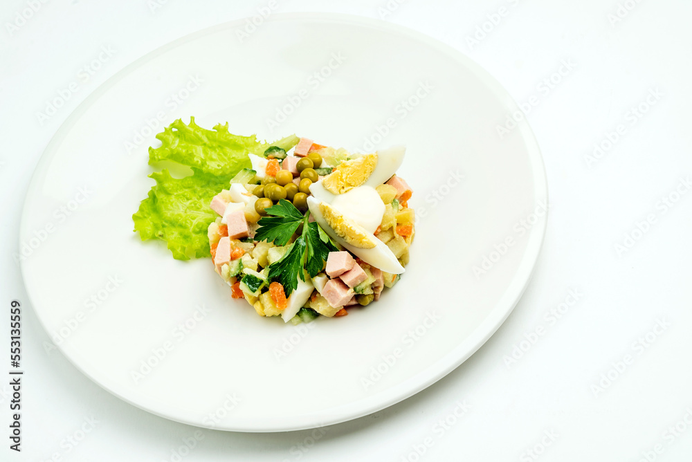 russian salad on the white plate russian salad on the white plate