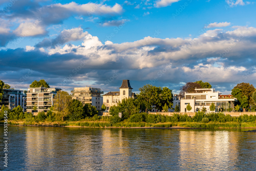 Germany, Saxony-Anhalt, Magdeburg, Clouds over riverside apartments of Werder district Germany, Saxony-Anhalt, Magdeburg, Clouds over riverside apartments of Werder district