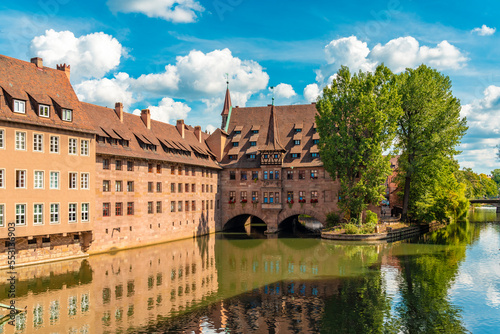 Germany, Bavaria, Nuremberg, Historic Holy Spirit Hospital on Pegnitz river photo