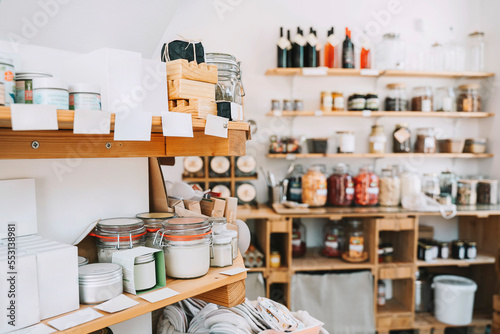 Cosmetics products in jars on shelf at store photo