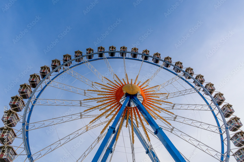 Ferris wheel under blue sky Ferris wheel under blue sky