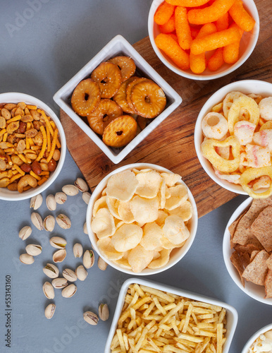 Party snacks, an assortment on gray with copy space © Aninka