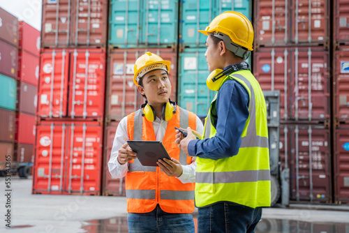 Photography Engineer with foreman checking the container to prepare the delivery to the customer