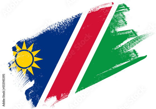 Abstract paint brush textured flag of namibia on white background photo