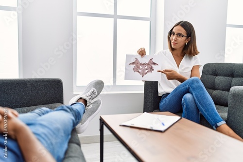 Man and woman having psychology session doing rorschach test at psychology clinic