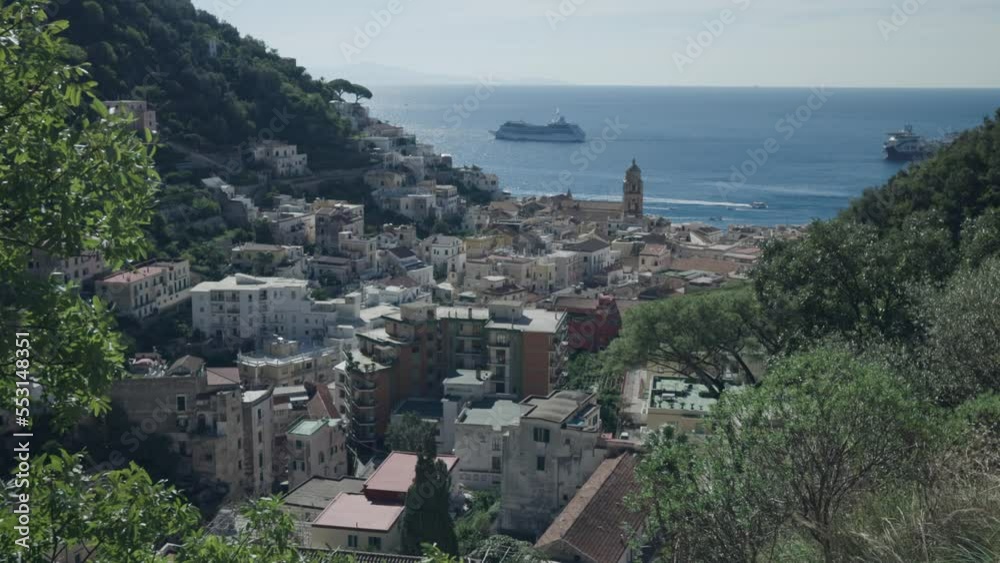 Distant View Of A Ferry Tourist Boat In Amalfi Coast, Positano Village, Italy. Wide Shot Distant View Of A Ferry Tourist Boat In Amalfi Coast, Positano Village, Italy. Wide Shot