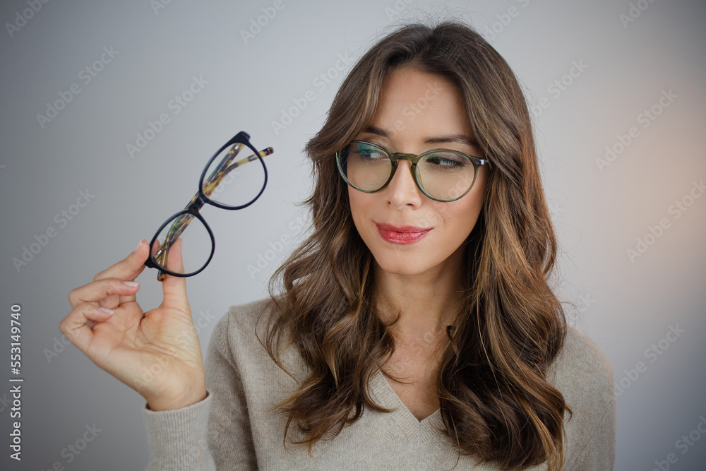 Woman with new glasses - obrazy, fototapety, plakaty 