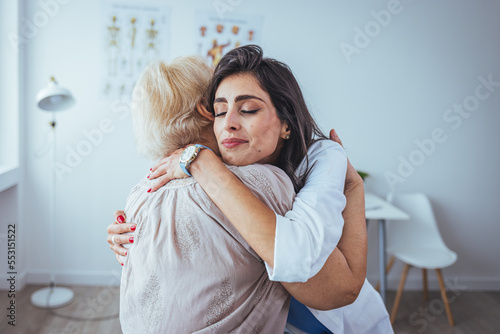 Konstfotografi Shot of a young woman doctor hugging her senior patient during a consultation