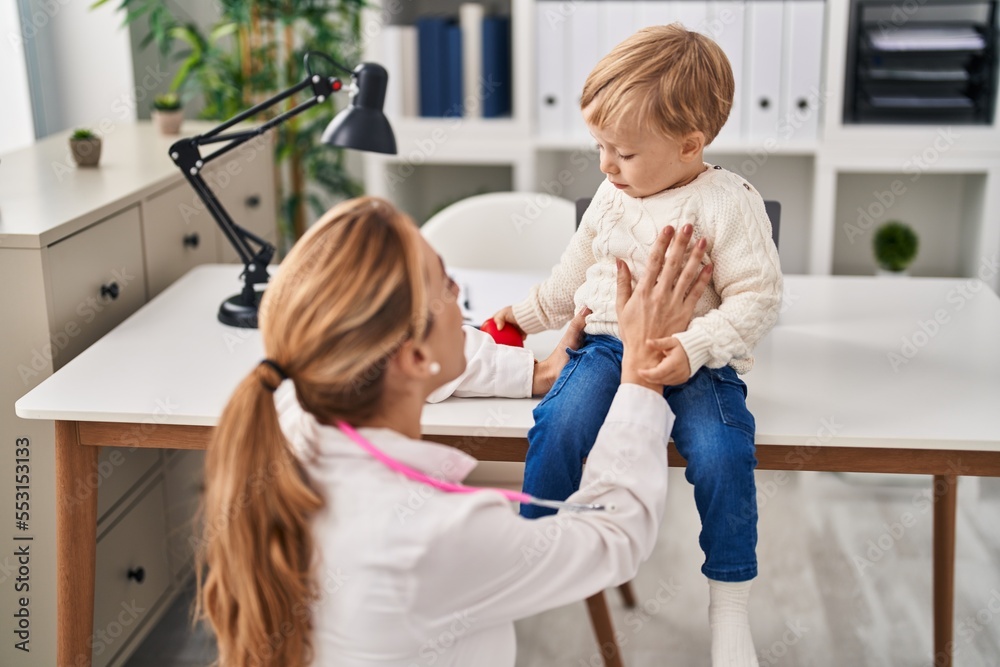Mother and son having pediatrician consultation and playing at clinic Mother and son having pediatrician consultation and playing at clinic