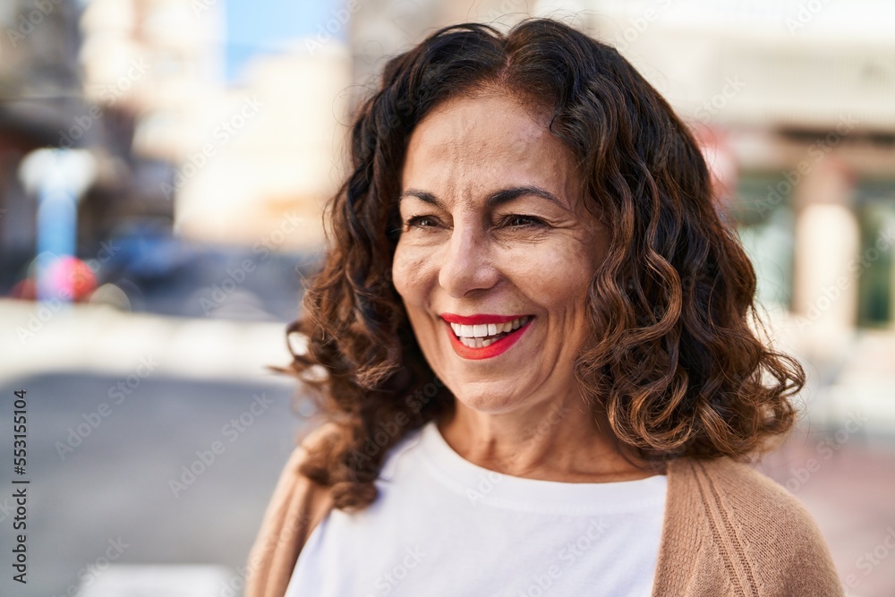 Middle age hispanic woman smiling happy outdoors Middle age hispanic woman smiling happy outdoors
