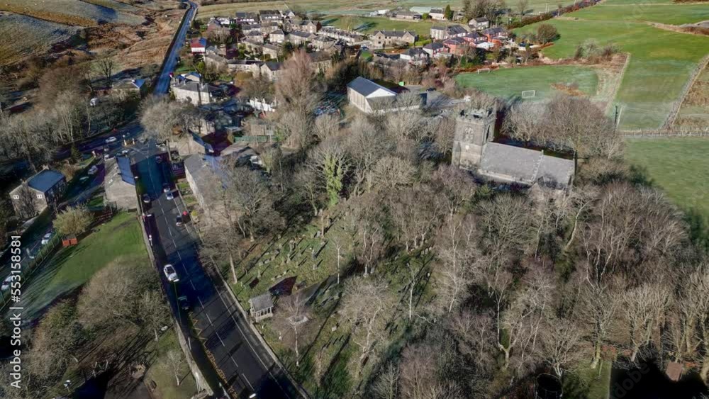 Aerial footage of the village of Denshaw, and the old church and ...