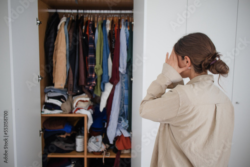 Cluttered Wardrobe Messy Chaos Overwhelmed Woman
