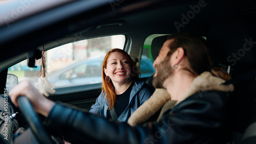 Man and woman couple smiling confident driving car at street © Krakenimages.com