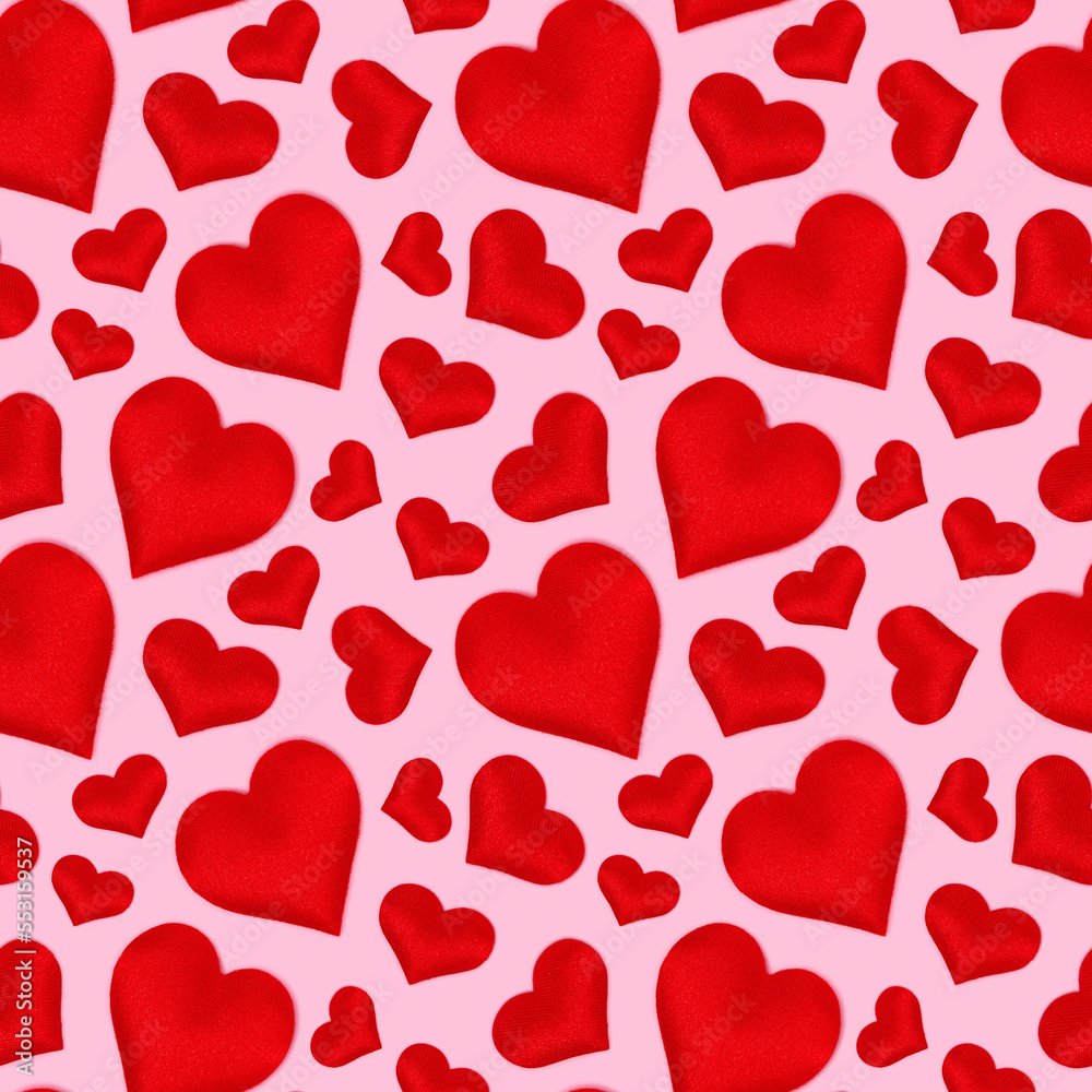 Seamless pattern made of red hearts. Creative concept on a pink background. Seamless pattern made of red hearts. Creative concept on a pink background.