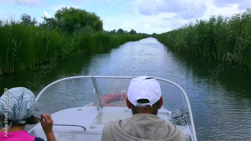 Danube Delta: Sailing on a motor boat through the canals near the town of Vilkovo (Ukraine).