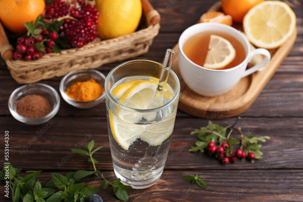 Delicious immunity boosting drink and ingredients on wooden table