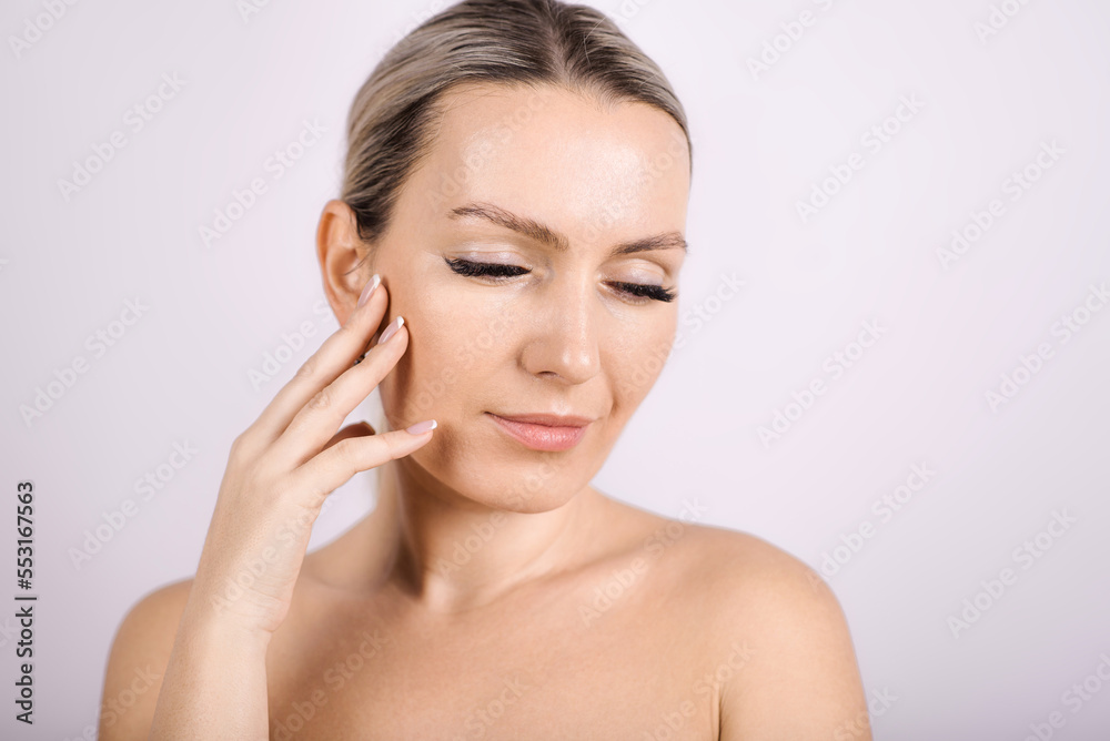 Portrait of a beautiful woman on a white background. The concept of skin care.