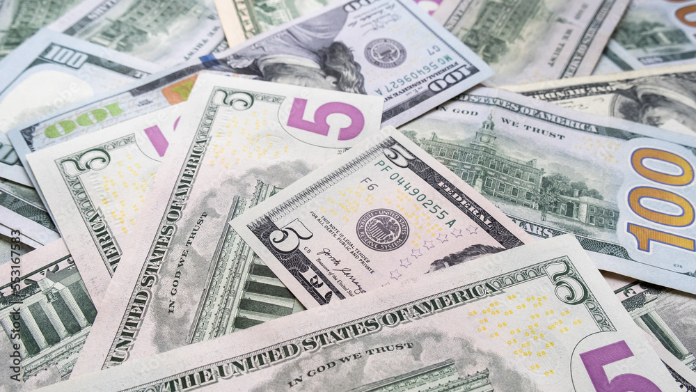 Background from different banknotes of dollars and euros. Concept of economic crisis and save money Background from different banknotes of dollars and euros. Concept of economic crisis and save money