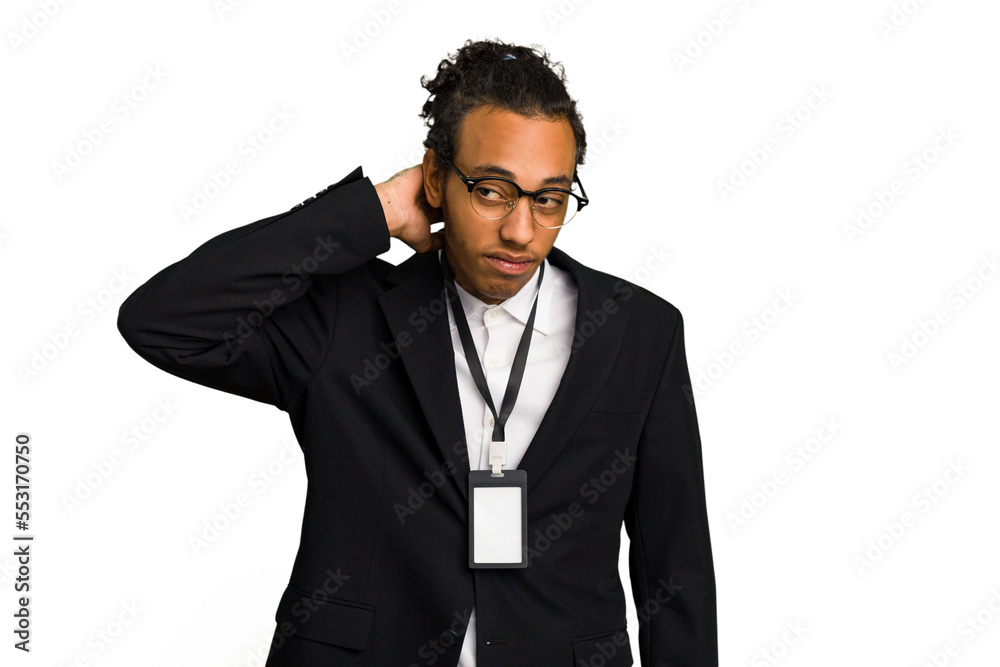 Young African American business man with badge isolated touching back of head, thinking and making a choice. Young African American business man with badge isolated touching back of head, thinking and making a choice.