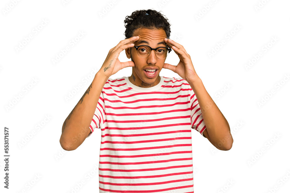 Young African American man isolated receiving a pleasant surprise, excited and raising hands. Young African American man isolated receiving a pleasant surprise, excited and raising hands.