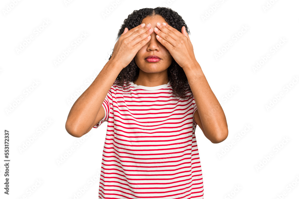 Young african american woman with curly hair cut out isolated afraid covering eyes with hands. Young african american woman with curly hair cut out isolated afraid covering eyes with hands.