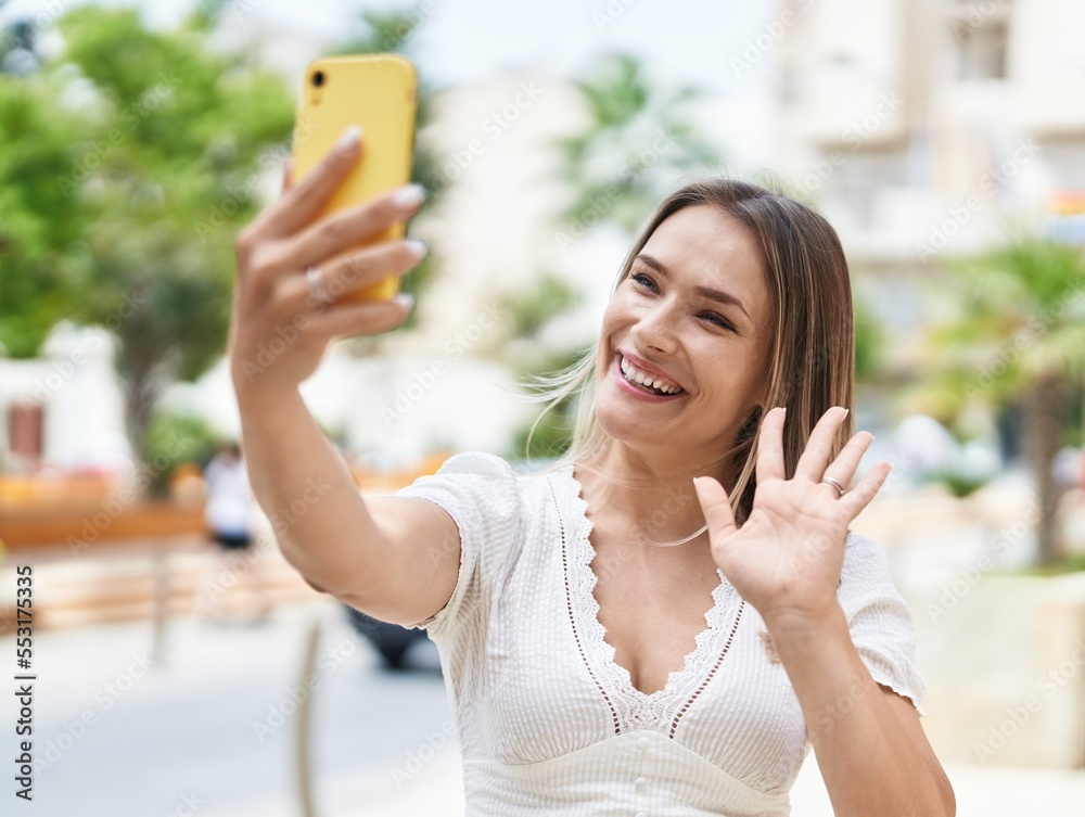 Young caucasian woman smiling confident having video call at street