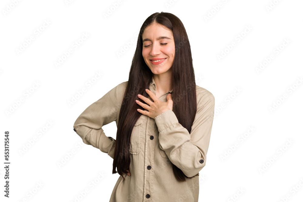 Young caucasian brunette long hair woman cutout isolated laughing keeping hands on heart, concept of happiness.