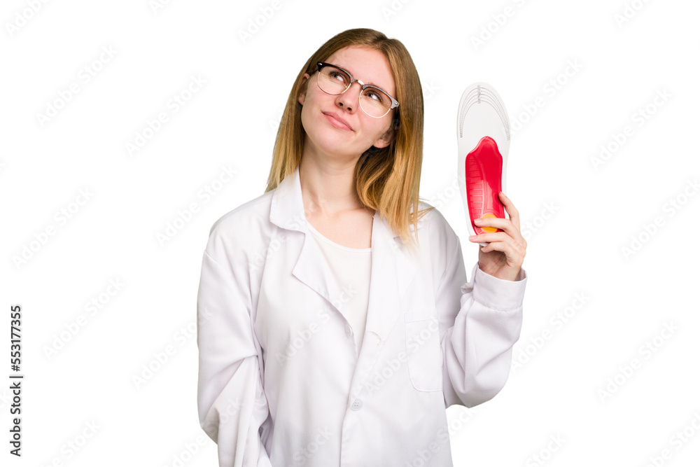Young caucasian chiropodist woman holding an insoles for shoes isolated dreaming of achieving goals and purposes Young caucasian chiropodist woman holding an insoles for shoes isolated dreaming of achieving goals and purposes