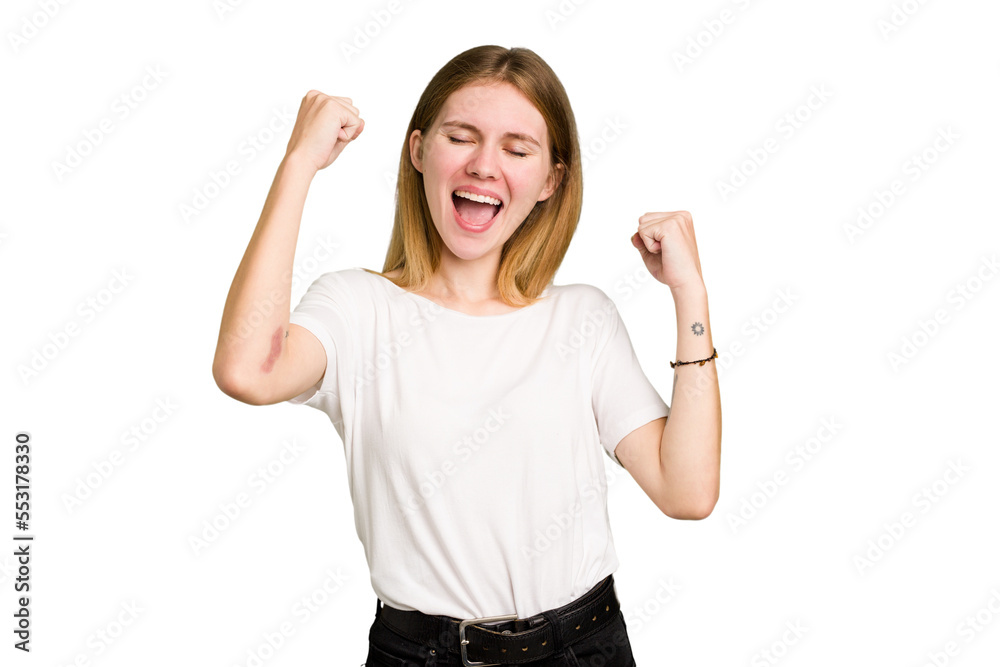Young caucasian woman isolated raising fist after a victory, winner concept. Young caucasian woman isolated raising fist after a victory, winner concept.