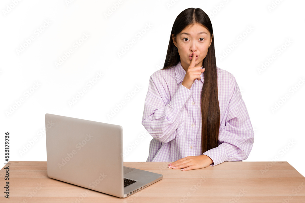 Young student asian woman in a workplace with a laptop isolated keeping a secret or asking for silence. Young student asian woman in a workplace with a laptop isolated keeping a secret or asking for silence.