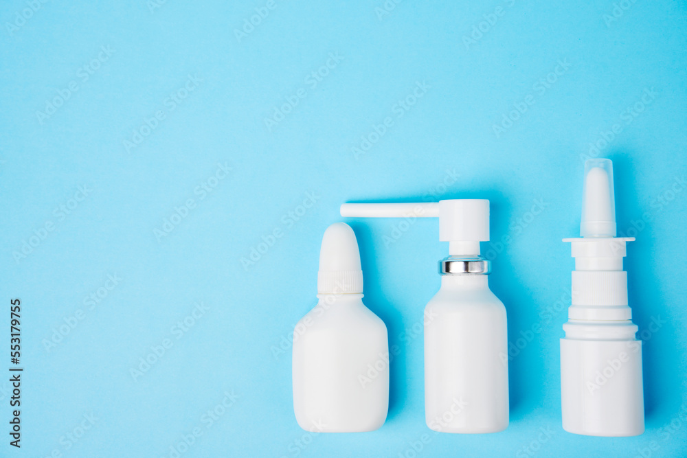 Nasal spray bottle on blue background with copy space Nasal spray bottle on blue background with copy space