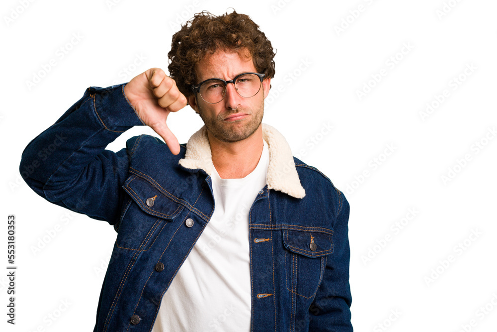 Young curly smart caucasian man cut out isolated showing thumb down and expressing dislike. Young curly smart caucasian man cut out isolated showing thumb down and expressing dislike.