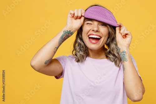 Photography Calm young woman wear purple pyjamas jam rest relax at home take off sleep eye blindfold mask wink look camera smiling isolated on plain yellow background studio portrait