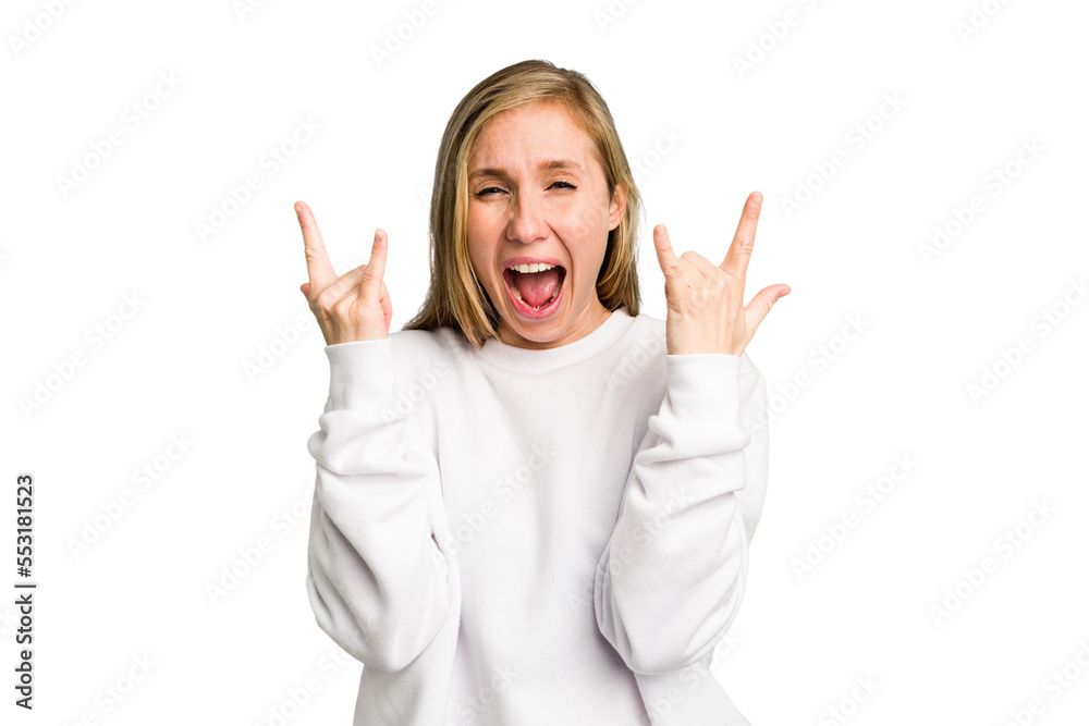 Young caucasian woman cutout isolated showing a horns gesture as a revolution concept.