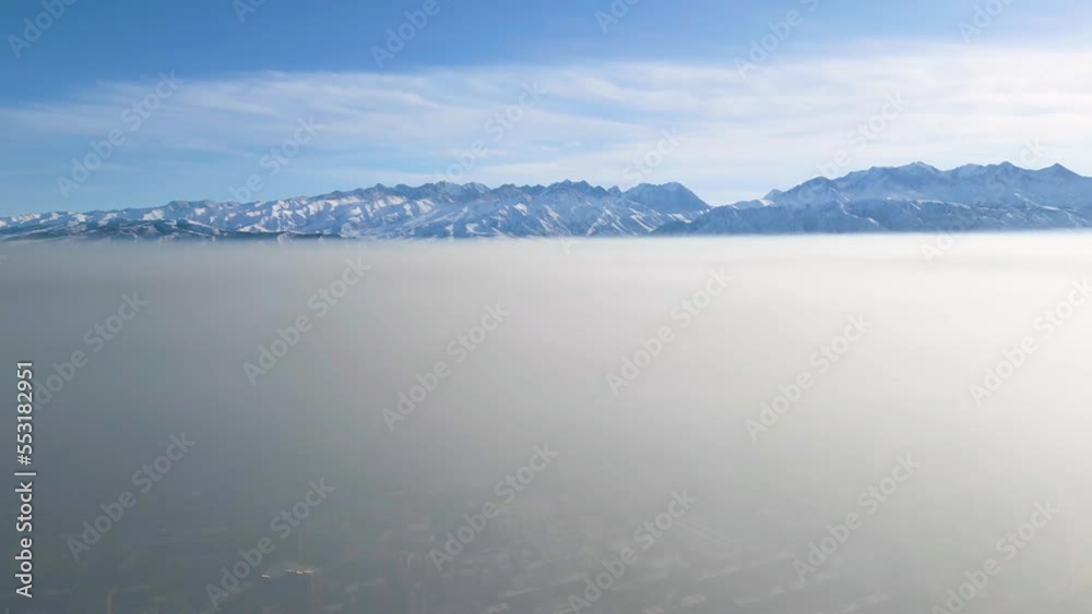 Aerial view of polluted city covered with smog Aerial view of polluted city covered with smog