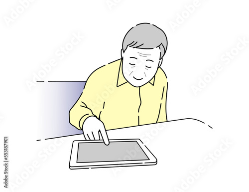 タブレットを操作する高齢者の男性