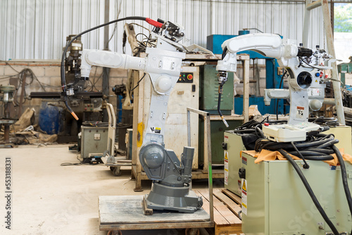 Automatic robot arm system welding machine in the industry factory. Industry robot manufacturing technology