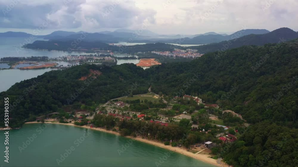 Drone forward flying capturing Teluk Batik beach with marina island and damar laut in the background, straits of malacca, Lumut, Perak, Malaysia, Southeast Asia.